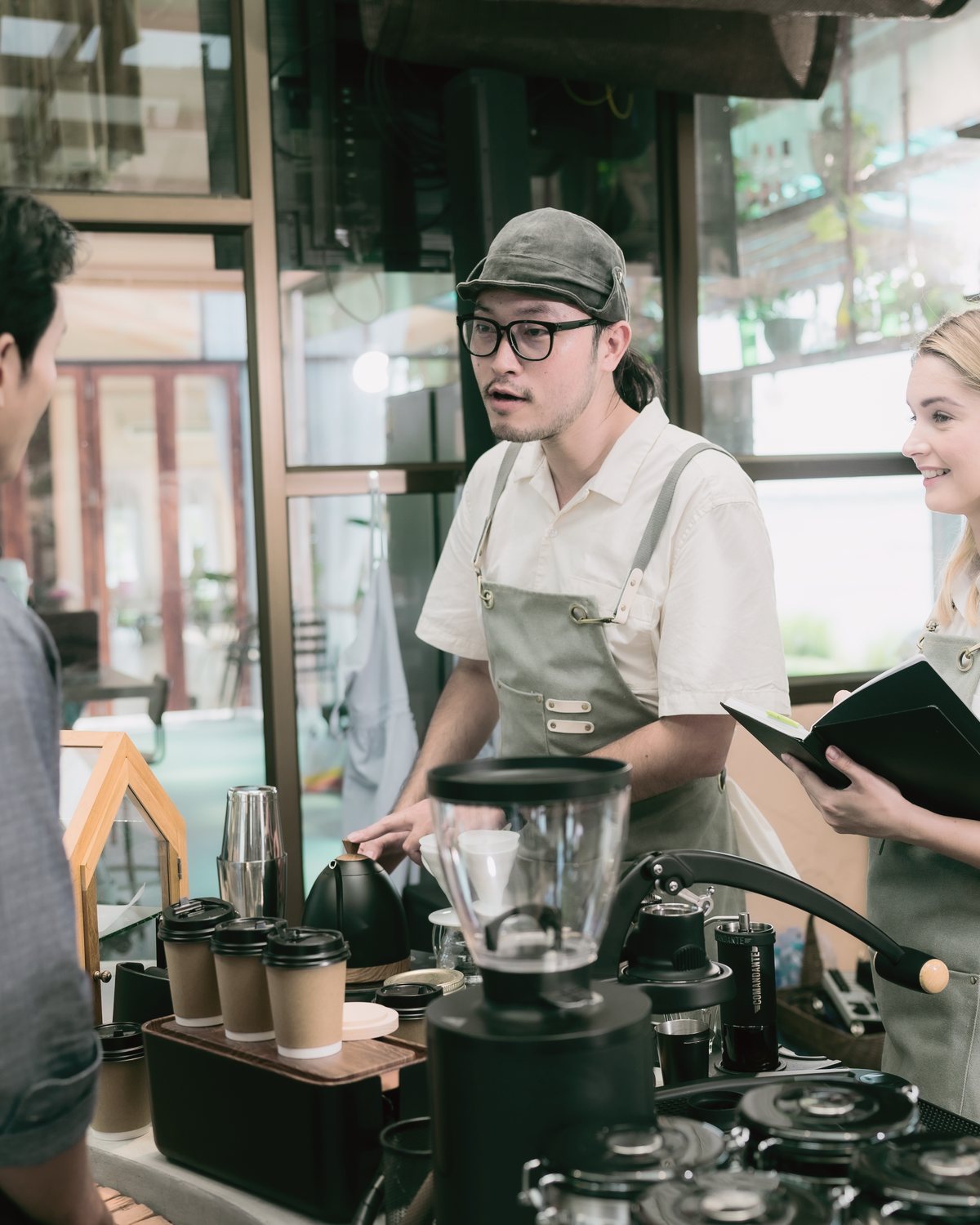 Two customers ordering at the counter.