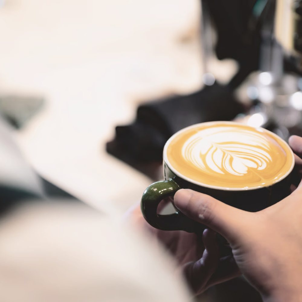A latte handed across the bar.